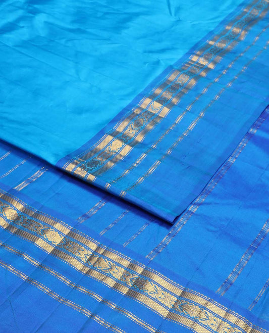 Blue kancheepuram silk saree with contrast ganga jamuna border of rekku, muthu, kuyil kann design & striped pallu