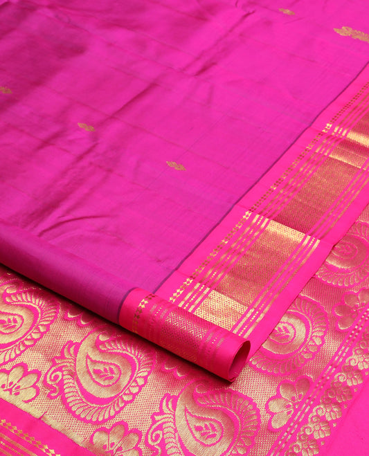 Pink zari buttas Kanchipuram silk saree, contrast one-sided border of paneer sombu, banaras, muthu, and jaal design, and manga design pallu