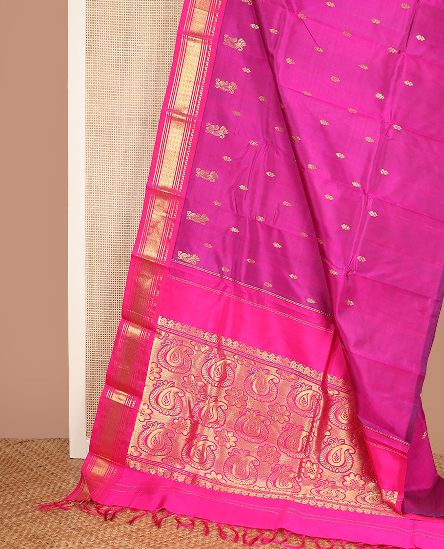 Pink zari buttas Kanchipuram silk saree, contrast one-sided border of paneer sombu, banaras, muthu, and jaal design, and manga design pallu