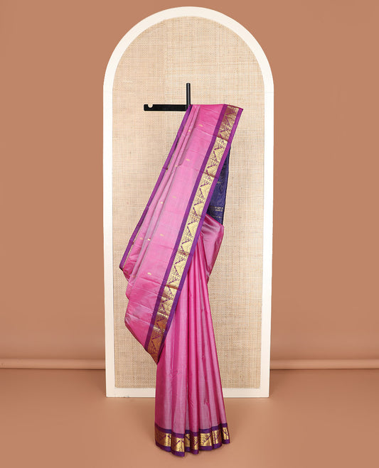 Pink zari buttas Kanchipuram silk saree, contrast border of thilakam mokku, poun, thazampoo rekku, and neli designs, and zari design pallu