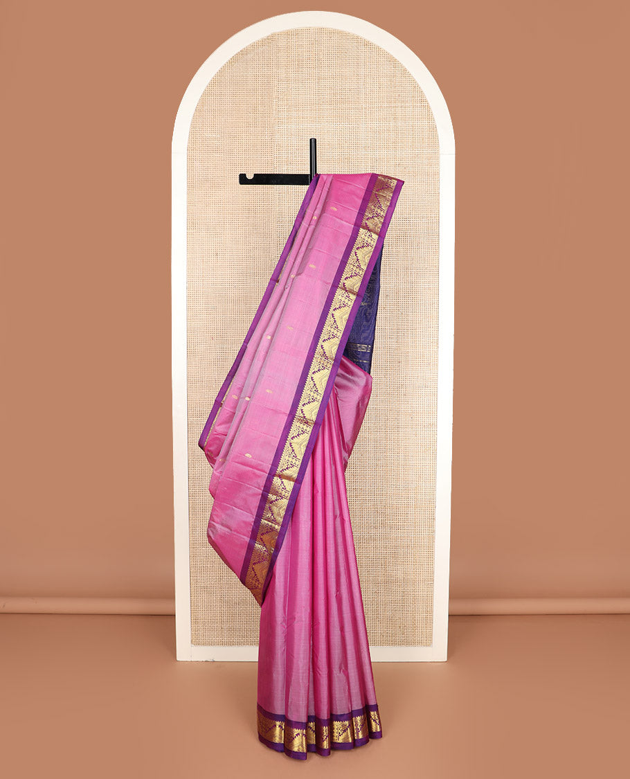 Pink zari buttas Kanchipuram silk saree, contrast border of thilakam mokku, poun, thazampoo rekku, and neli designs, and zari design pallu