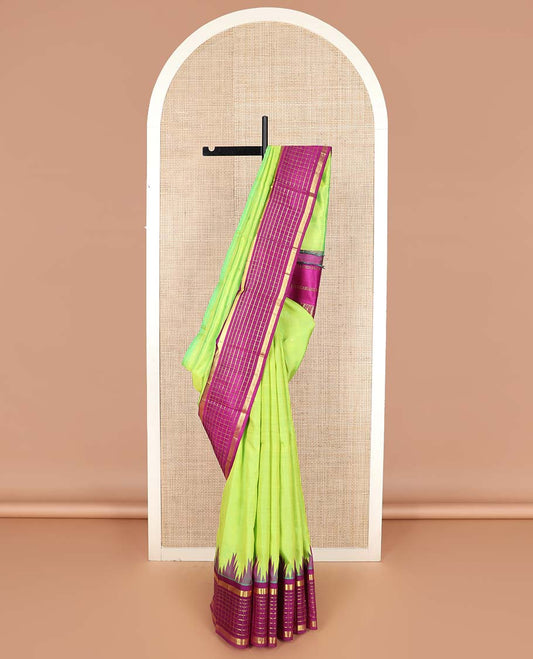 Green zari buttas Kanchipuram silk saree, contrast thazampoo rekku one-sided border of muthu, and muthu kattam designs, and pallu of pillaiyar mokku designs