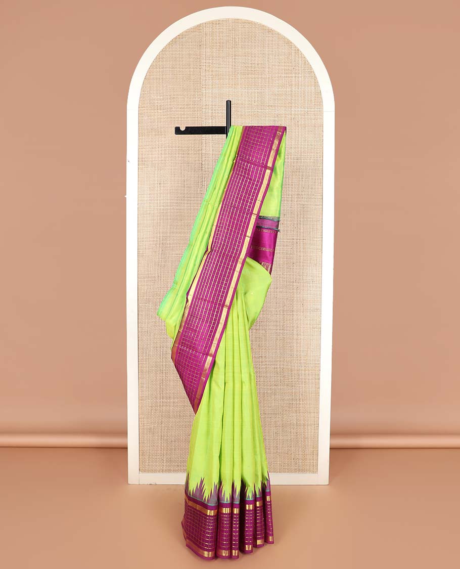 Green zari buttas Kanchipuram silk saree, contrast thazampoo rekku one-sided border of muthu, and muthu kattam designs, and pallu of pillaiyar mokku designs