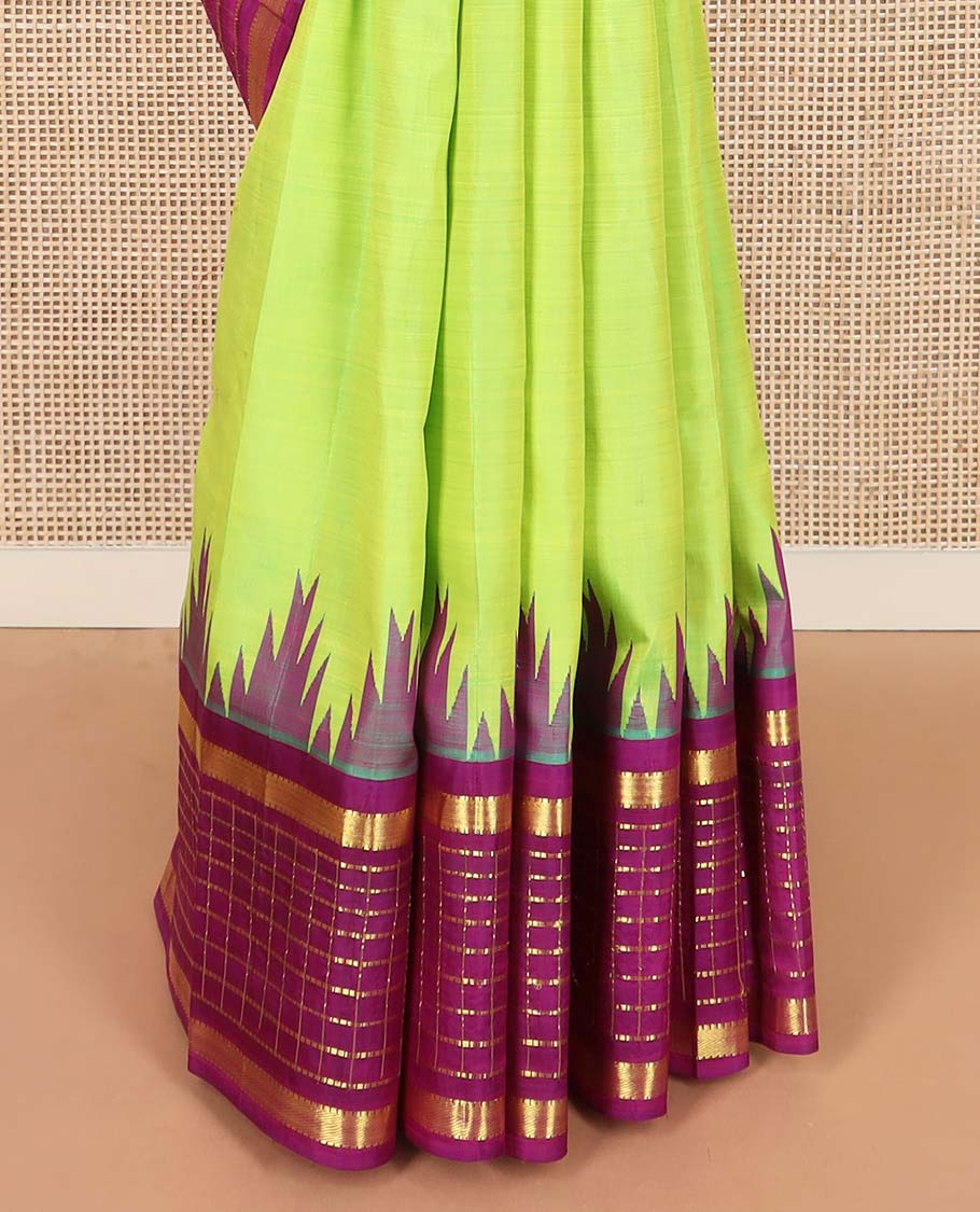 Green zari buttas Kanchipuram silk saree, contrast thazampoo rekku one-sided border of muthu, and muthu kattam designs, and pallu of pillaiyar mokku designs