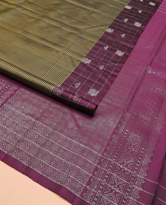 Green stripes and muthu striped Kanchipuram silk saree, contrast border of mayil and lotus butta enclosed checks, and intricate jaal pallu