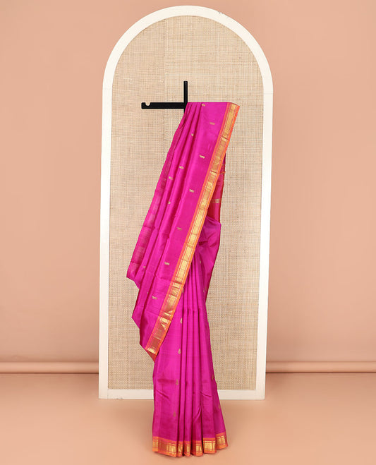 Rani Pink Kanchipuram Silk Saree Embellished with Zari Buttas All Over Its Body, Complemented by Contrast One-Sided Border of Banaras, and Mayil Kann Designs, Pallu Bedecked with Zari Designs, and Comes Without a Blouse