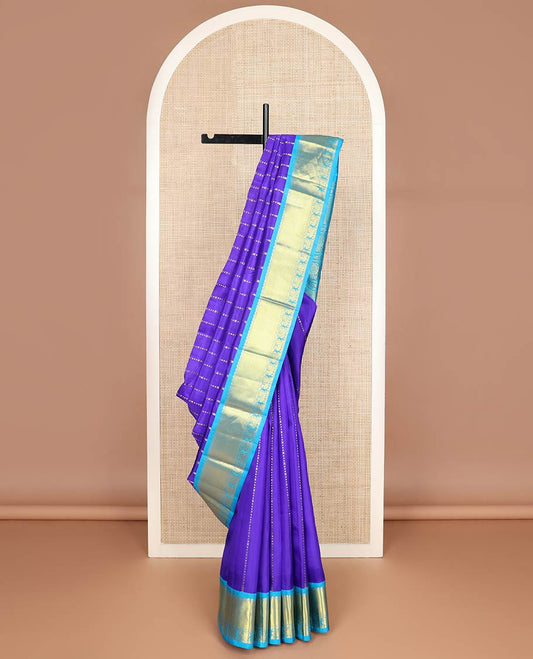 Violet zari design Kanchipuram silksaree, contrast one-sided korvai border & pallu of salngai, lavangam & mayil designs