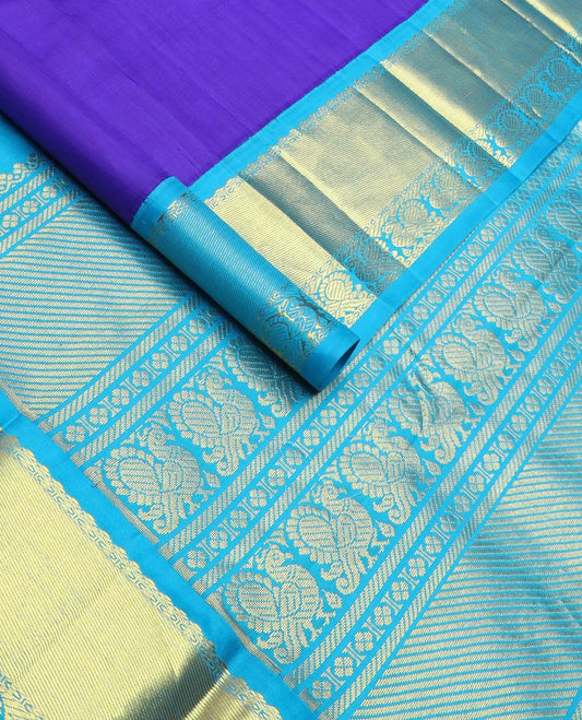 Violet zari design Kanchipuram silksaree, contrast one-sided korvai border & pallu of salngai, lavangam & mayil designs