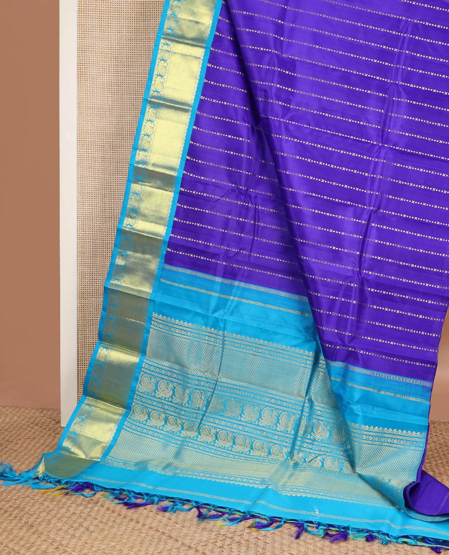 Violet zari design Kanchipuram silksaree, contrast one-sided korvai border & pallu of salngai, lavangam & mayil designs