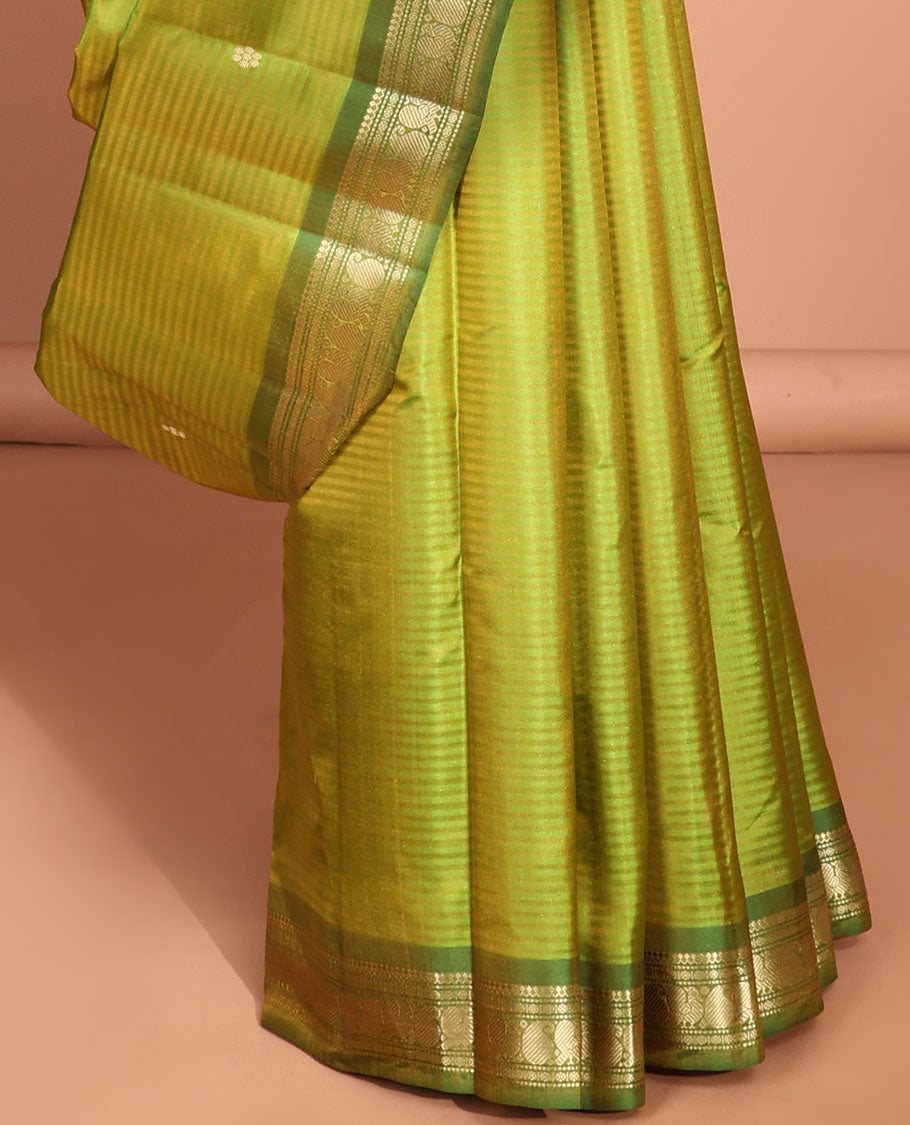 Green striped flower buttas kancheepuram silk saree with contrast border of sombu, paisley design & zari design pallu