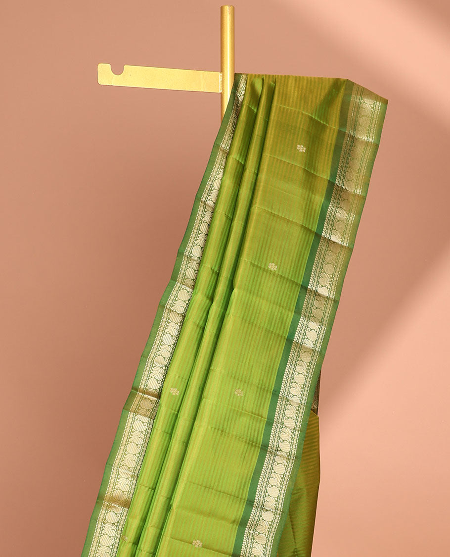 Green striped flower buttas kancheepuram silk saree with contrast border of sombu, paisley design & zari design pallu