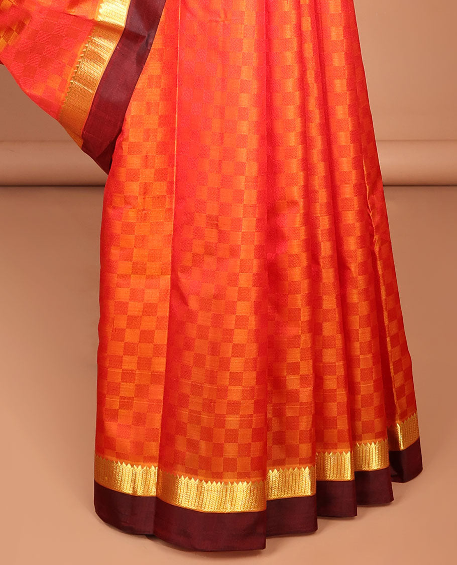 Orange checked kancheepuram silk saree with contrast temple border & checked design pallu
