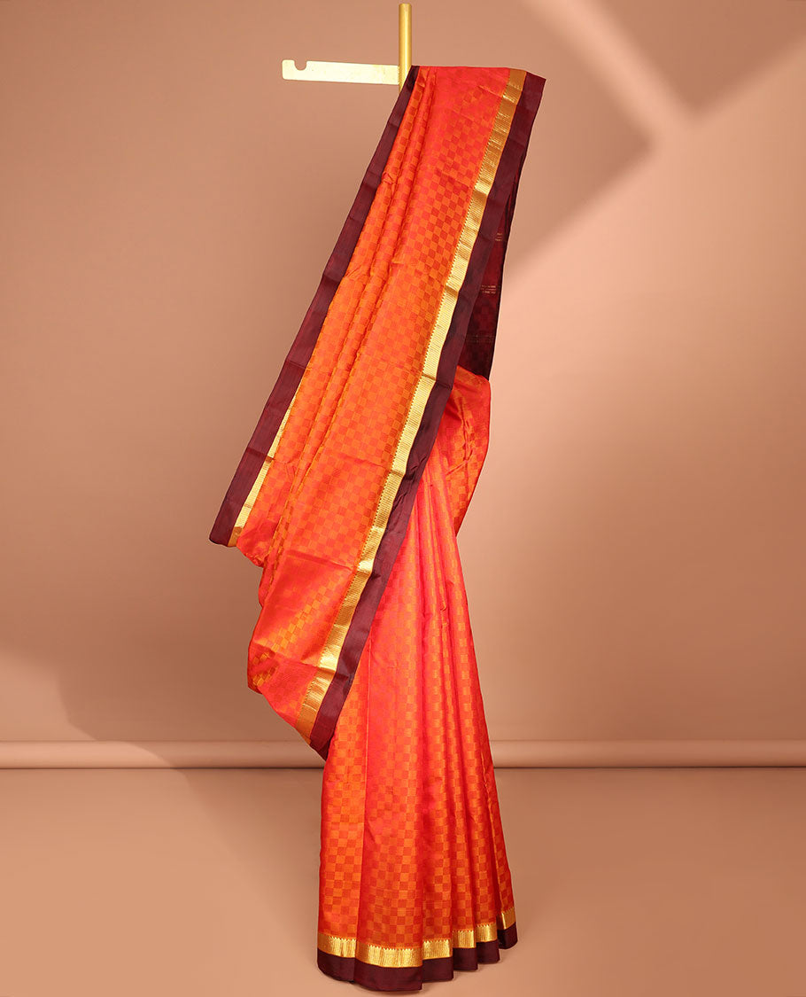 Orange checked kancheepuram silk saree with contrast temple border & checked design pallu