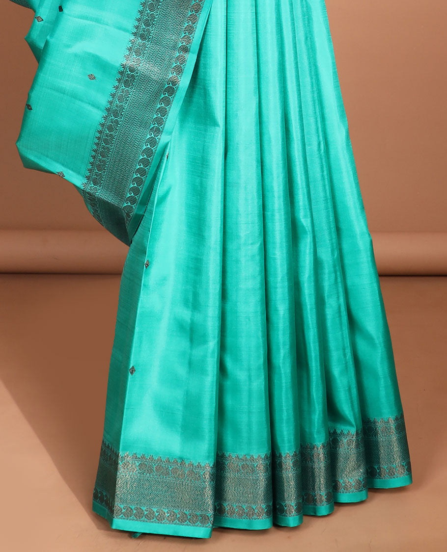 Blue buttas kancheepuram silk saree with self border of rekku,muthu,mayil, paisley design & intricate zari design pallu