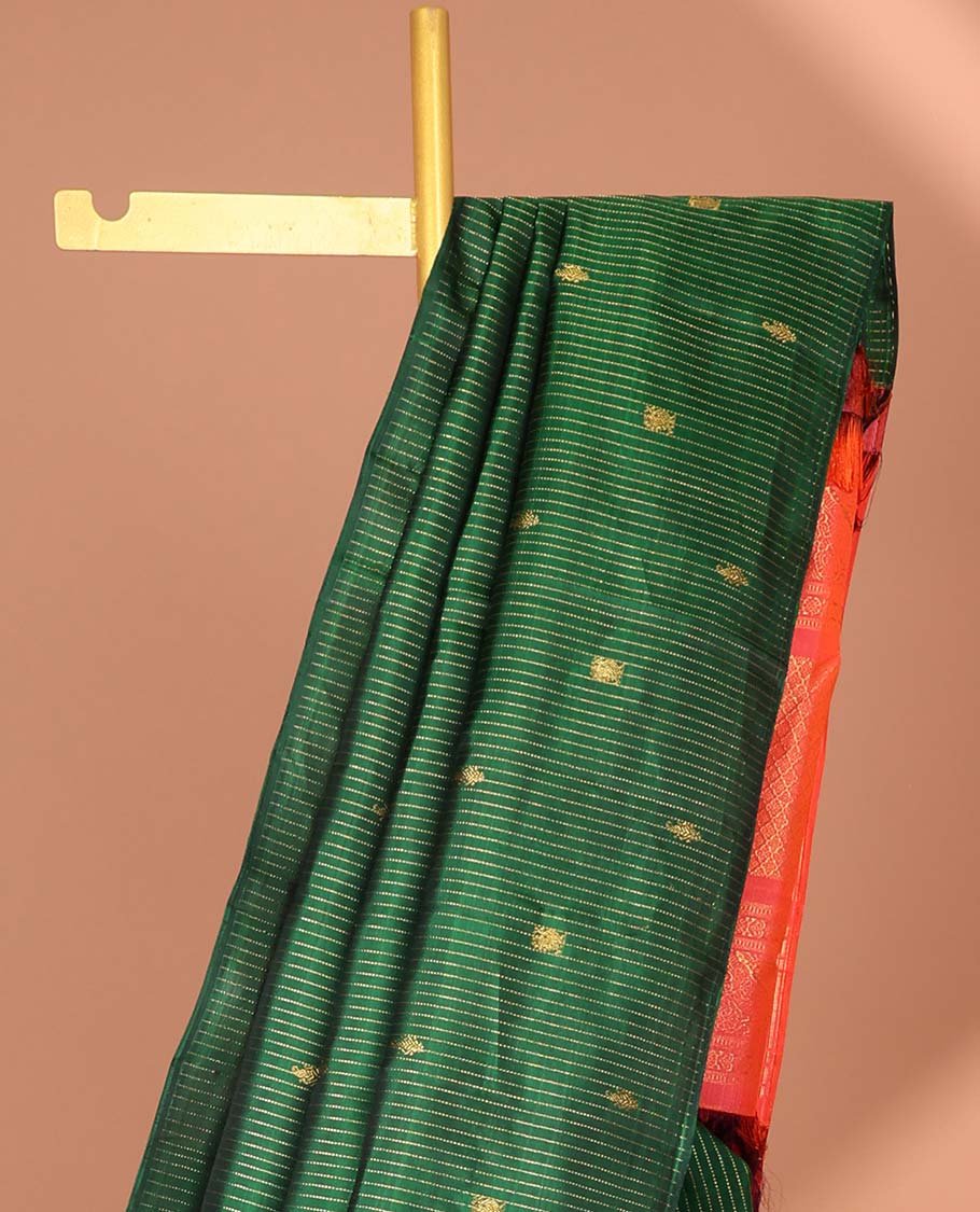 Borderless green kanchipuram silk saree with zari buttas, contrast pallu of jaal & yaanai designs
