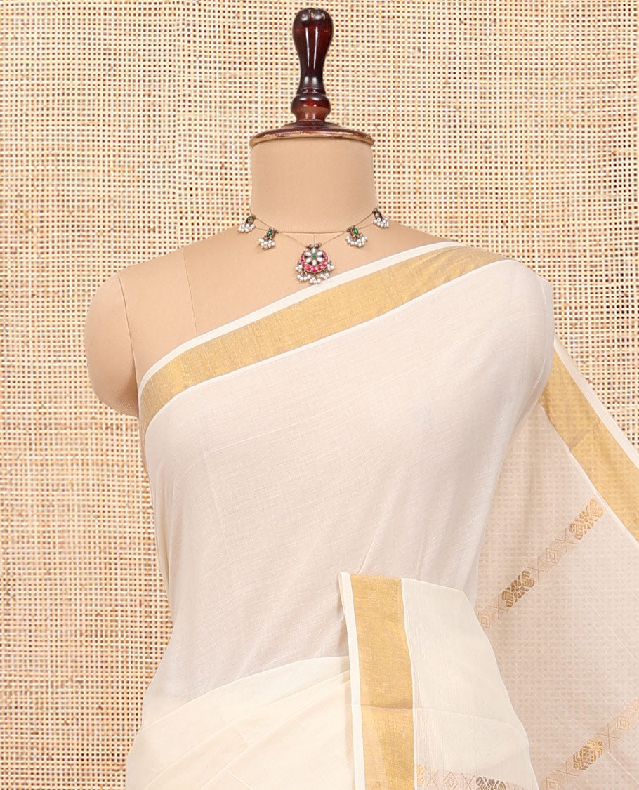 Cream Kerala Cotton Saree, Decorated with Zari Stripes All Over Its Body, a Subtle Bavanji Border, Pallu Features Chakram Designs, and Is Paired with a Matching Blouse