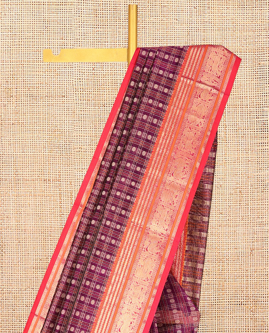 Purple Kuppadam Silk Saree, Adorned with Butta Enclosed Checks, a Contrast Traditional Peacock-Yaali Border, Pallu of Traditional Designs, and a Matching Blouse
