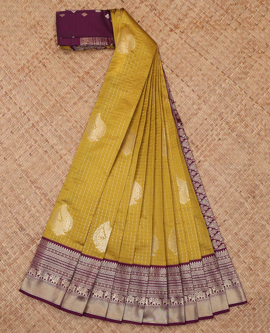 Mustard Litchi Saree, Gleamed Up with Zari Buttas and Checks, a Contrast Traditional Zari Border, Grand Pallu, and a Contrast Blouse