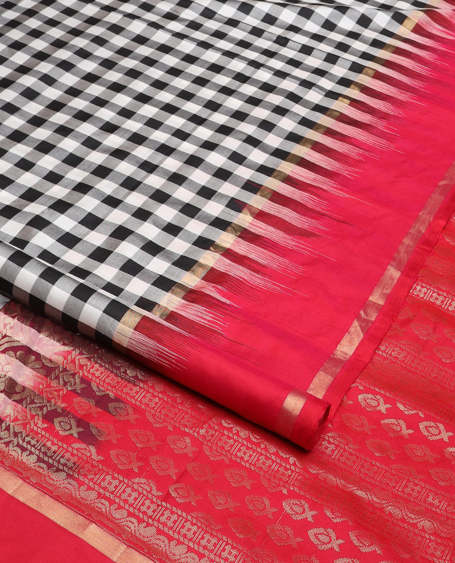 Black and white checked silk saree, contrast rettai pettu zari striped border, and pallu of geometric designs
