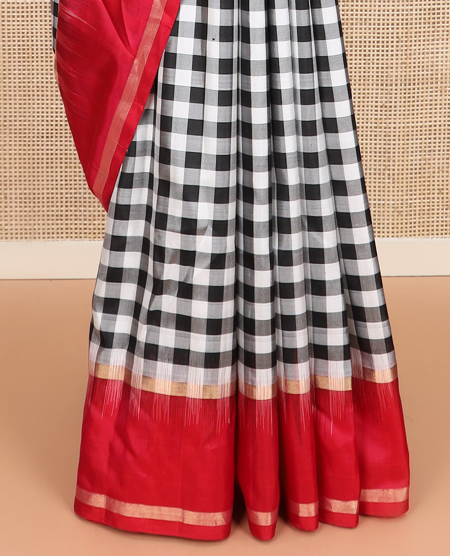 Black and white checked silk saree, contrast rettai pettu zari striped border, and pallu of geometric designs
