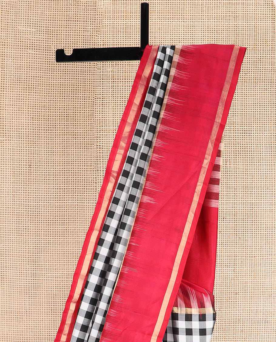 Black and white checked silk saree, contrast rettai pettu zari striped border, and pallu of geometric designs