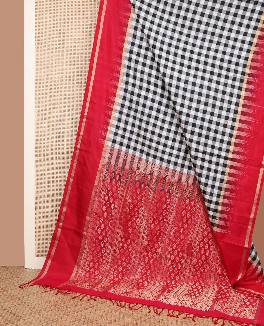 Black and white checked silk saree, contrast rettai pettu zari striped border, and pallu of geometric designs