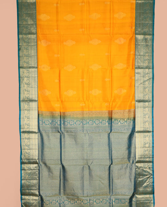 Orange zari buttas nine-yard silk saree, contrast border of thilakam mokku, Muthu, rudraksham, and mayil designs, and jaal pallu