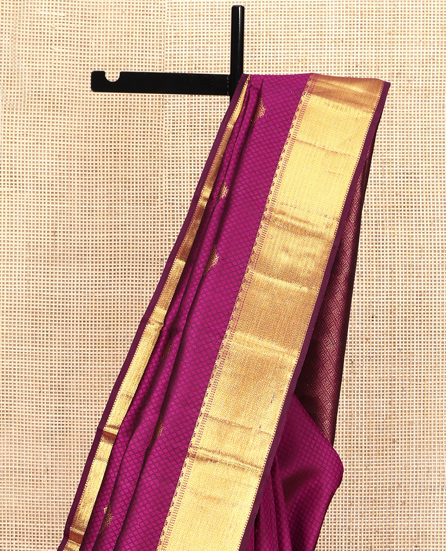 Wine Parampara Silk Saree, Enriched with Zari Buttas and Embossed Texture On Its Body, Highlighted by Zari Border of Thazampoo Rekku, Muthu, and Vanki Designs, Pallu Features Vanki Designs and Paired with a Matching Blouse