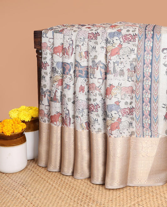 Cream all-over animal, fifure motif digtal printed with contrast gold zari jacquard border & printed rich pallu along with contrast plain blouse
