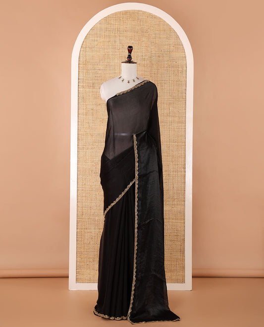 Black fendy chiffon saree with hand work border & self pallu along with hand work blouse