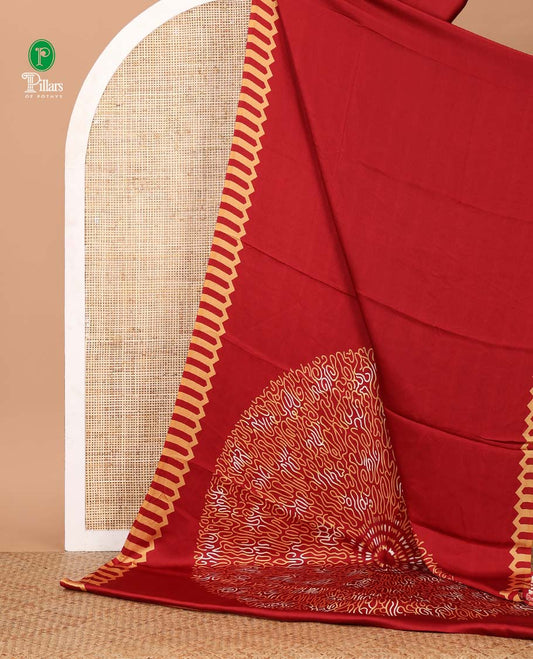 Maroon plain gajji silk saree features a temple-printed border, a circular-shaped vine-patterned pallu, and a unique motif-printed blouse