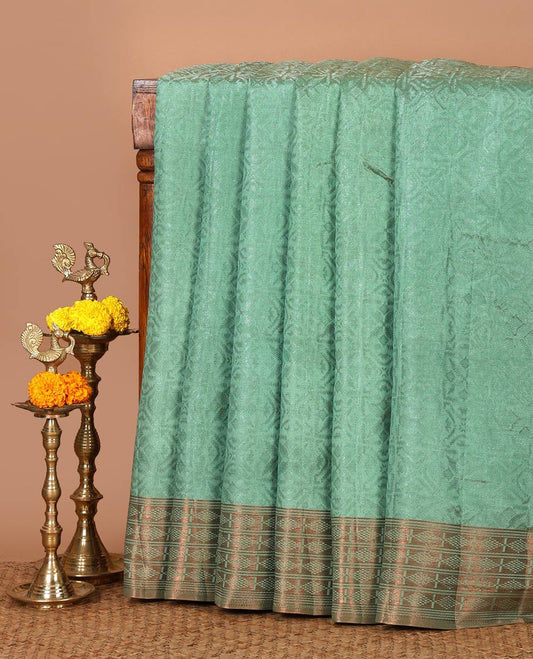 Green embossed thread weave art tussar saree, copper zari border & pallu of intricate designs