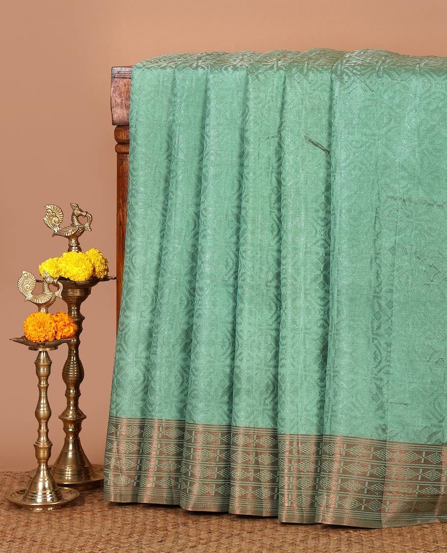 Green embossed thread weave art tussar saree, copper zari border & pallu of intricate designs