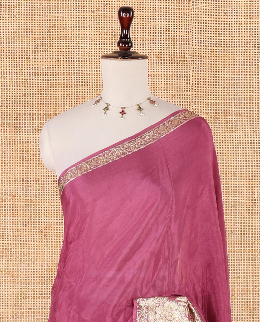 Onion pink plain crepe saree, zari border steeped with rose floral designs, plain pallu & blouse of zari polka dots