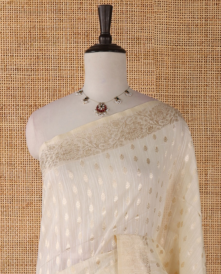 Cream banarasi jute saree with zari buttas, floral creeper zari border, floral jaal zari woven pallu & zari woven blouse