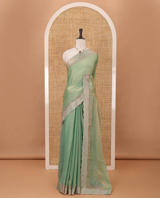 Pastle green plain fendy-chiffon saree, scallop Swarovski copper stone work border & contrast Swarovski copper stonework blouse