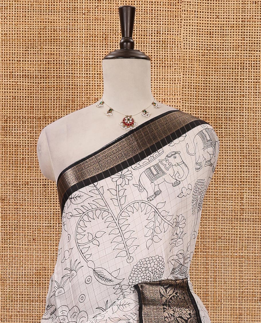 White zari checked flora-fauna printed Dola silksaree, contrast floral creeper zari black border, printed pallu & printed blouse with zariwork