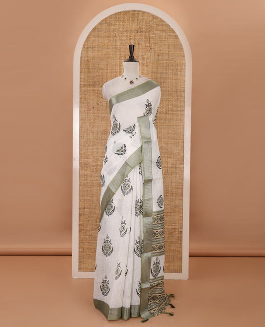 White unique motifs printed linen saree, contrast bavanji silver zari border, floral-geometric printed pallu & green motifs printed blouse