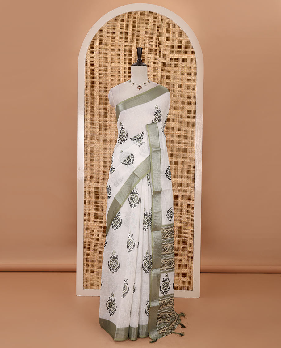 White unique motifs printed linen saree, contrast bavanji silver zari border, floral-geometric printed pallu & green motifs printed blouse