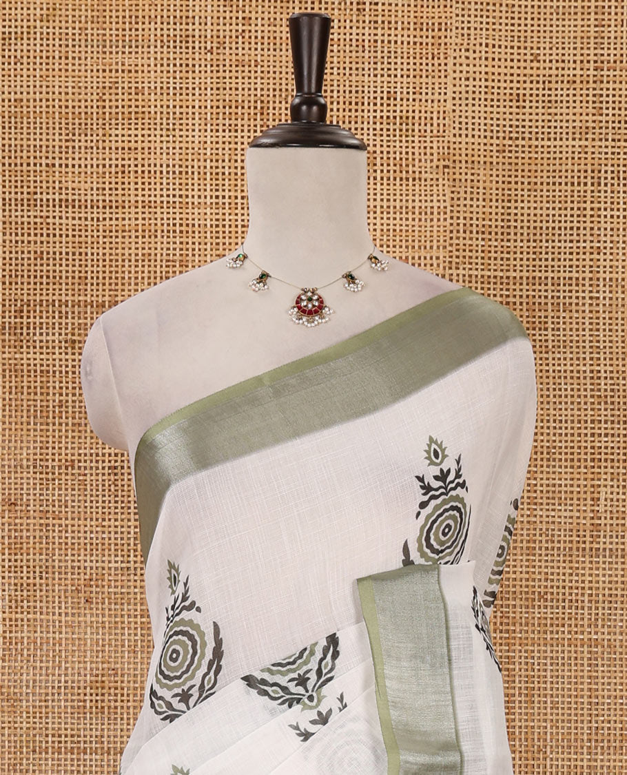 White unique motifs printed linen saree, contrast bavanji silver zari border, floral-geometric printed pallu & green motifs printed blouse