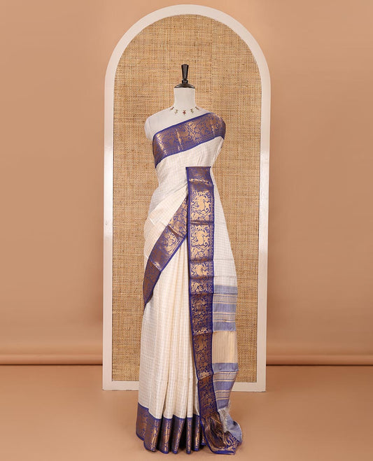 Half-white zari checked semi-taffeta silk saree, contrast deer motifs zari woven border, striped pallu & contrast striped zari border blouse