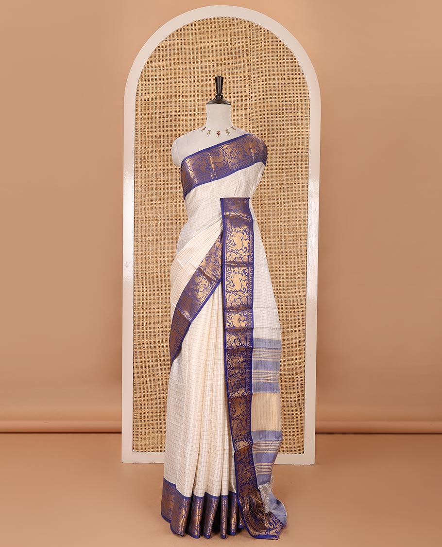 Half-white zari checked semi-taffeta silk saree, contrast deer motifs zari woven border, striped pallu & contrast striped zari border blouse