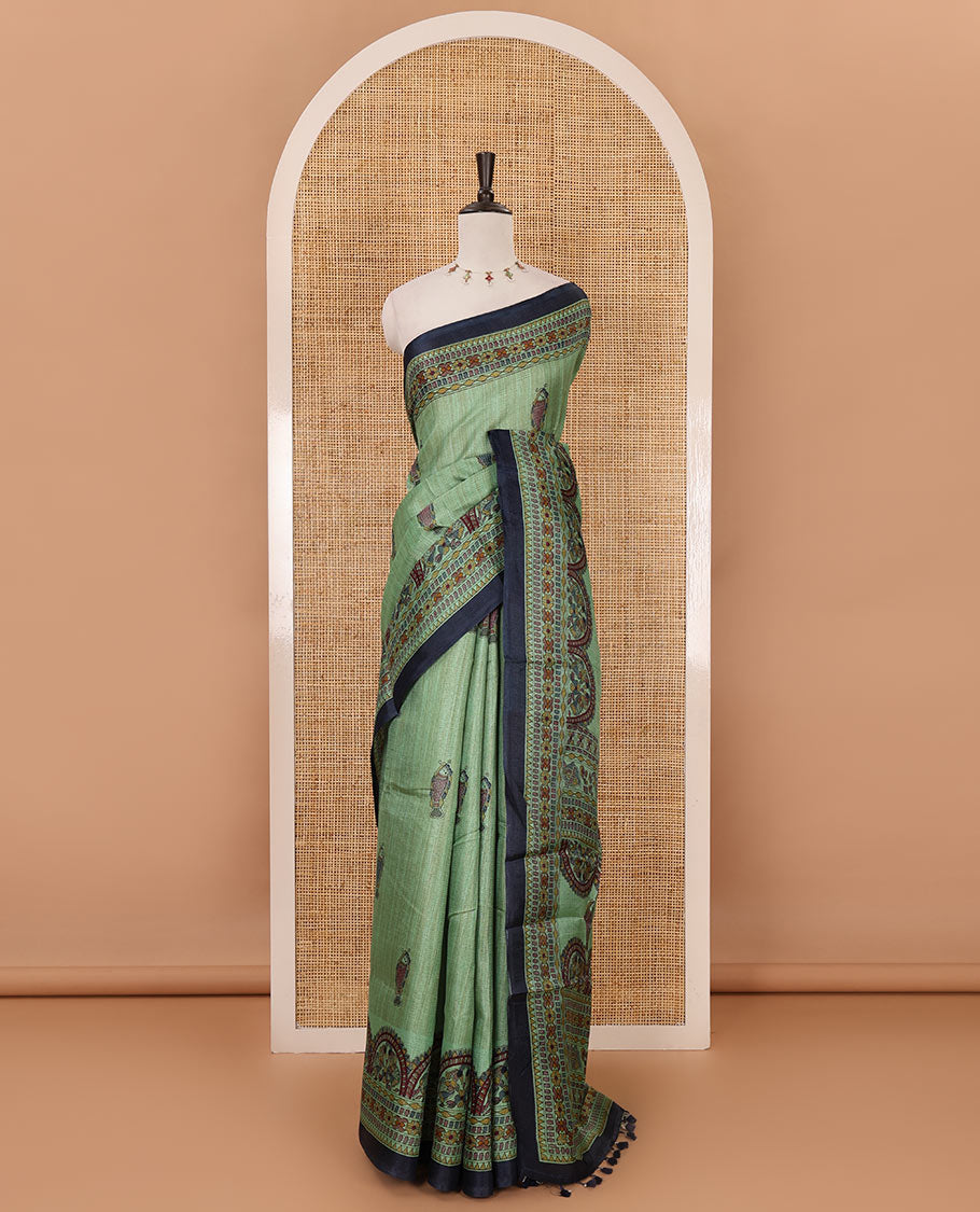 Green madhubani-style fish printed khadi cotton saree, floral printed border, madhubani printed pallu & contrast polka dots printed blouse