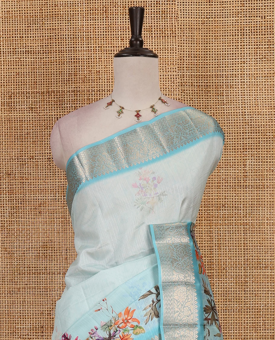 Sky blue tropical floral printed fancy tussar saree, contrast zari traditional design border, intricate Paisley motifs woven zari pallu, and printed blouse