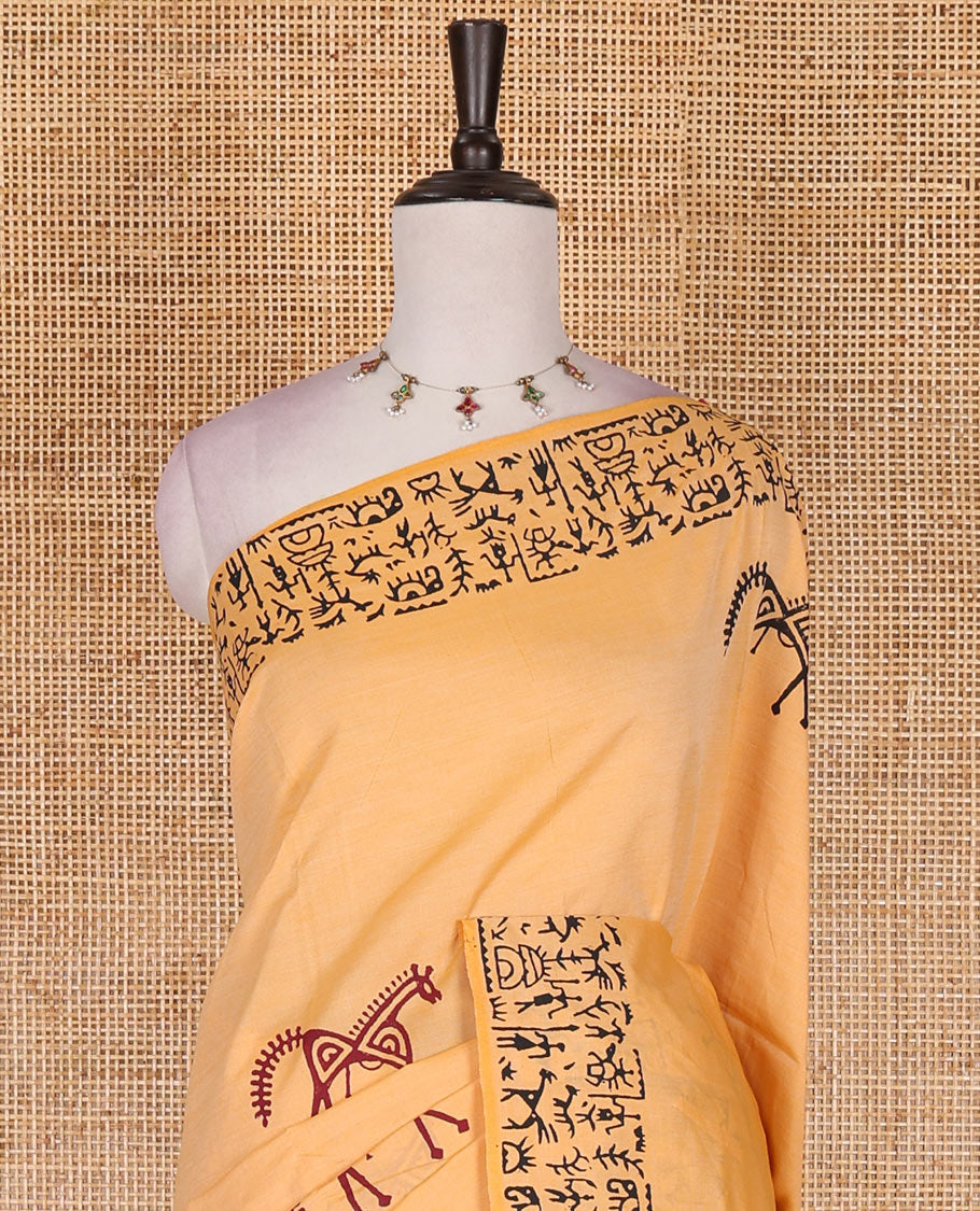 Peach Warli theme horse hand block printed South cotton saree, Warli hand block printed border and pallu, along with contrast handblock printed blouse