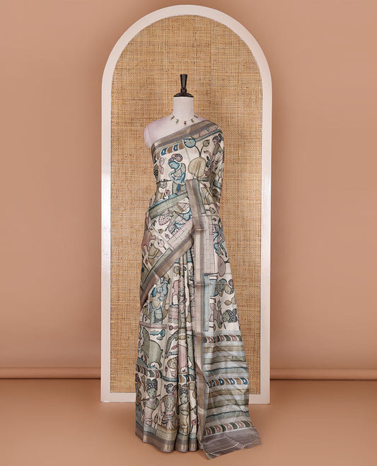 Chikku kalamkari ancient human figurines and animal motifs printed semi-tussar saree, gold zari piping border, printed pallu, and contrast printed blouse