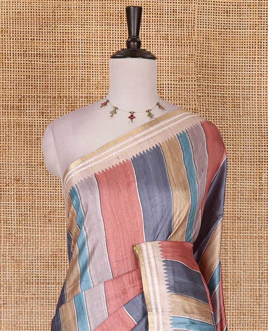 Multi color vertically striped semi-tussar saree, contrast resham thread border of temple and rudraksham motifs, striped pallu, and contrast striped printed blouse