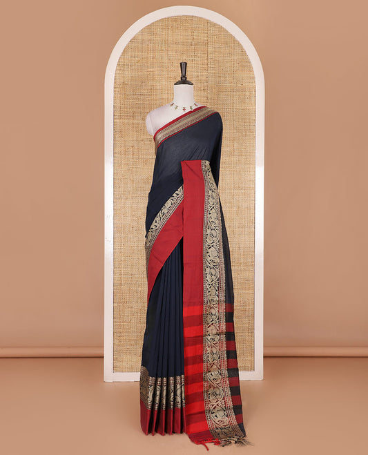 Navy blue plain mercerised cotton saree, contrast traditional border of peacock, and elephant motifs, striped pallu, and a matching blouse