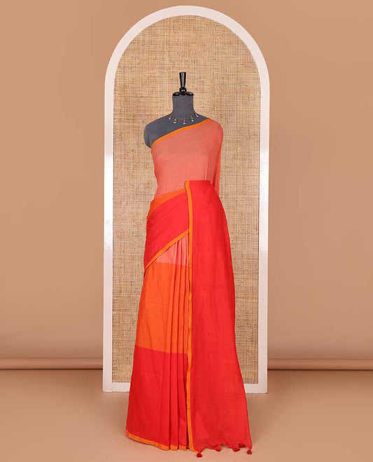 Borderless orange tri-ombre-colored plain khadi mul cotton saree with self-pallu, multi-colored tassels and a matching blouse