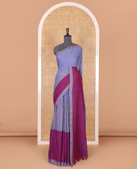 Borderless navy blue tri-ombre-colored plain khadi mul cotton saree with self-pallu, multi-colored tassels and a matching blouse